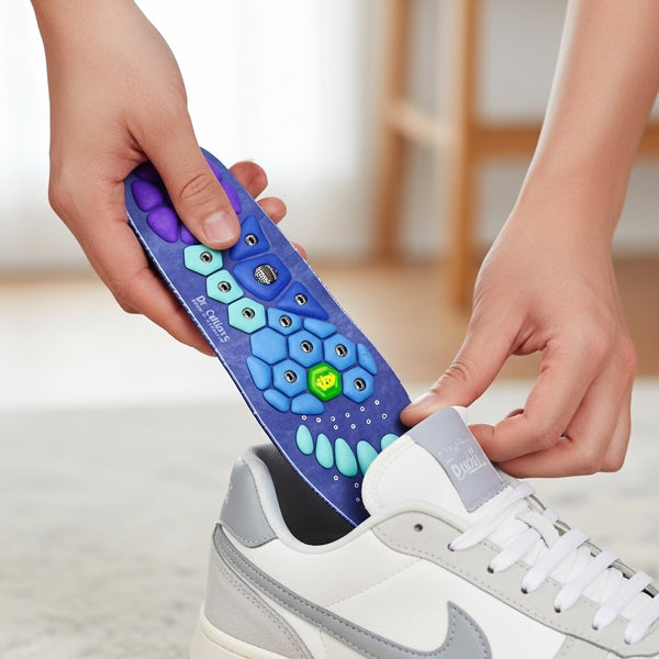 Person using an insole on a white sneaker with a blurred background